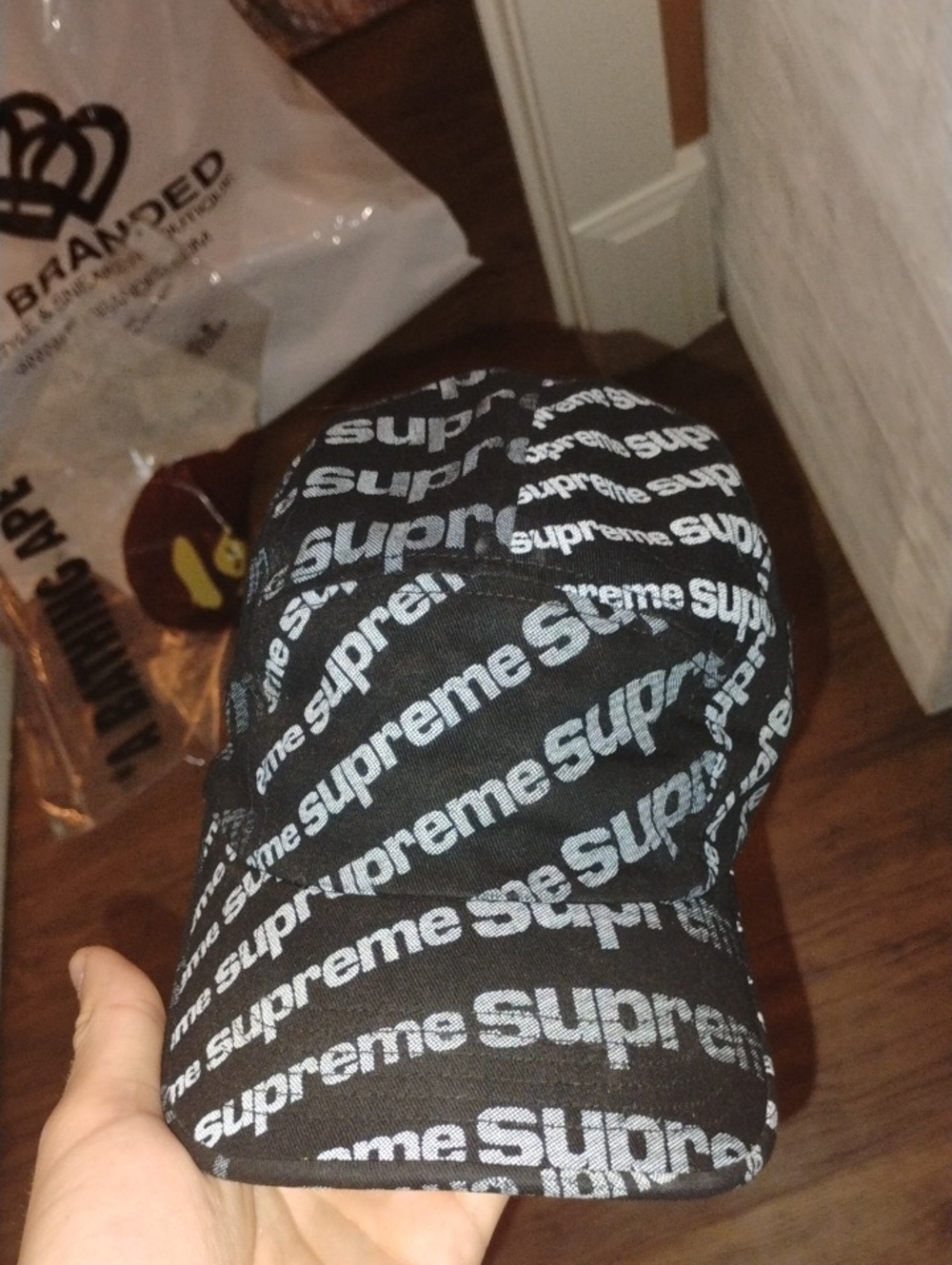 Supreme Black Cap with All-Over White Logo